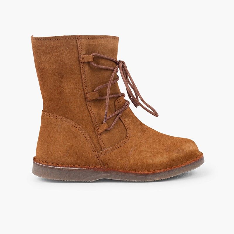 Bottes fille façon peau de mouton avec lacets croisés et fermeture éclair